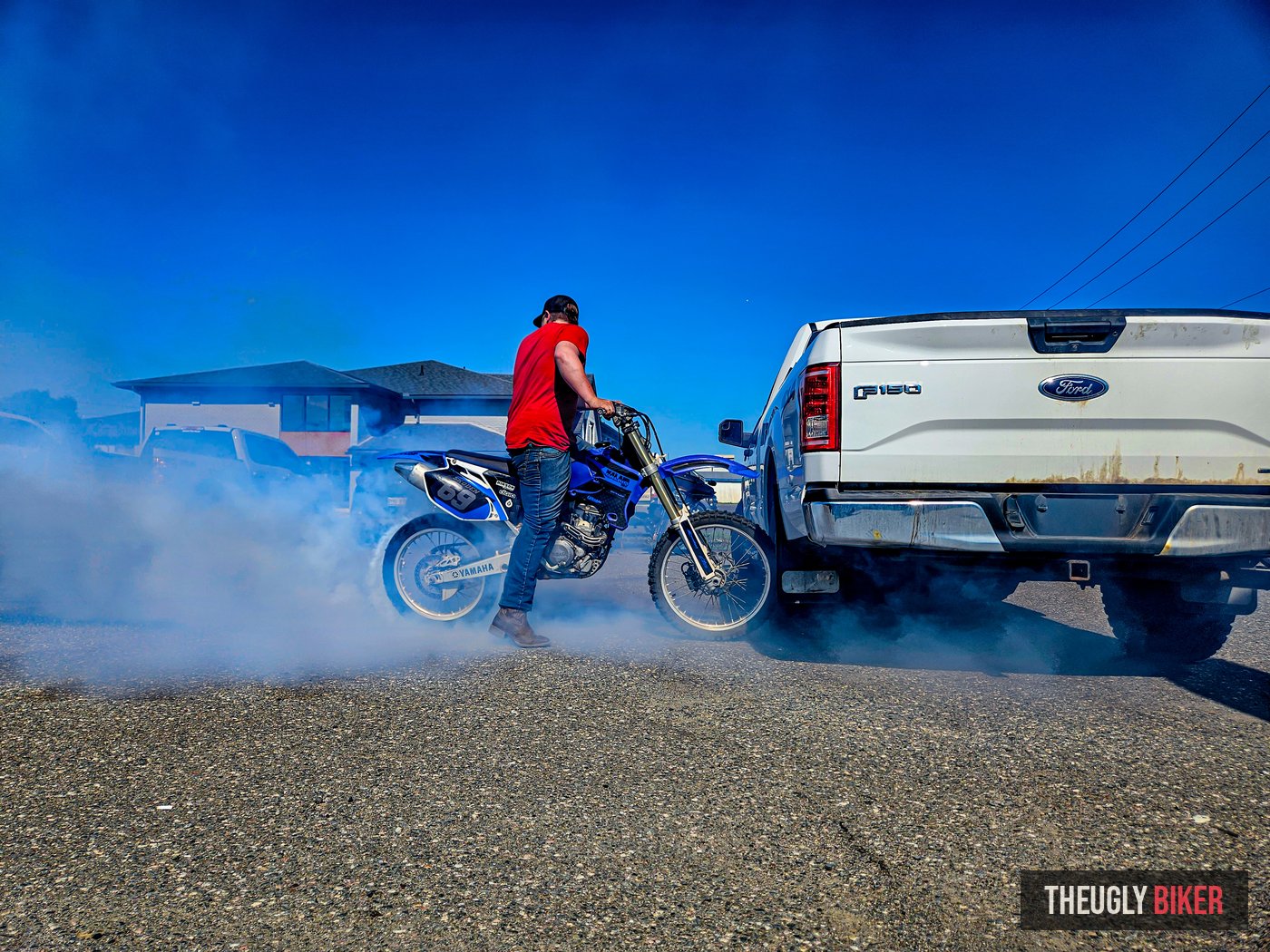 Dirt bike burnout with smoke cloud